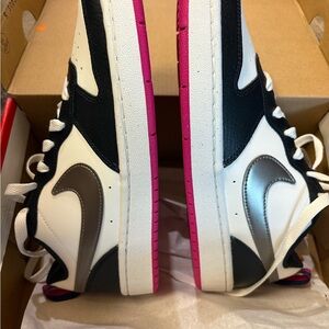 Stylish Black and White Nike Sneakers with Pink Soles